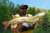 USFS Biologist Chunk Lane with a Troph Musky.